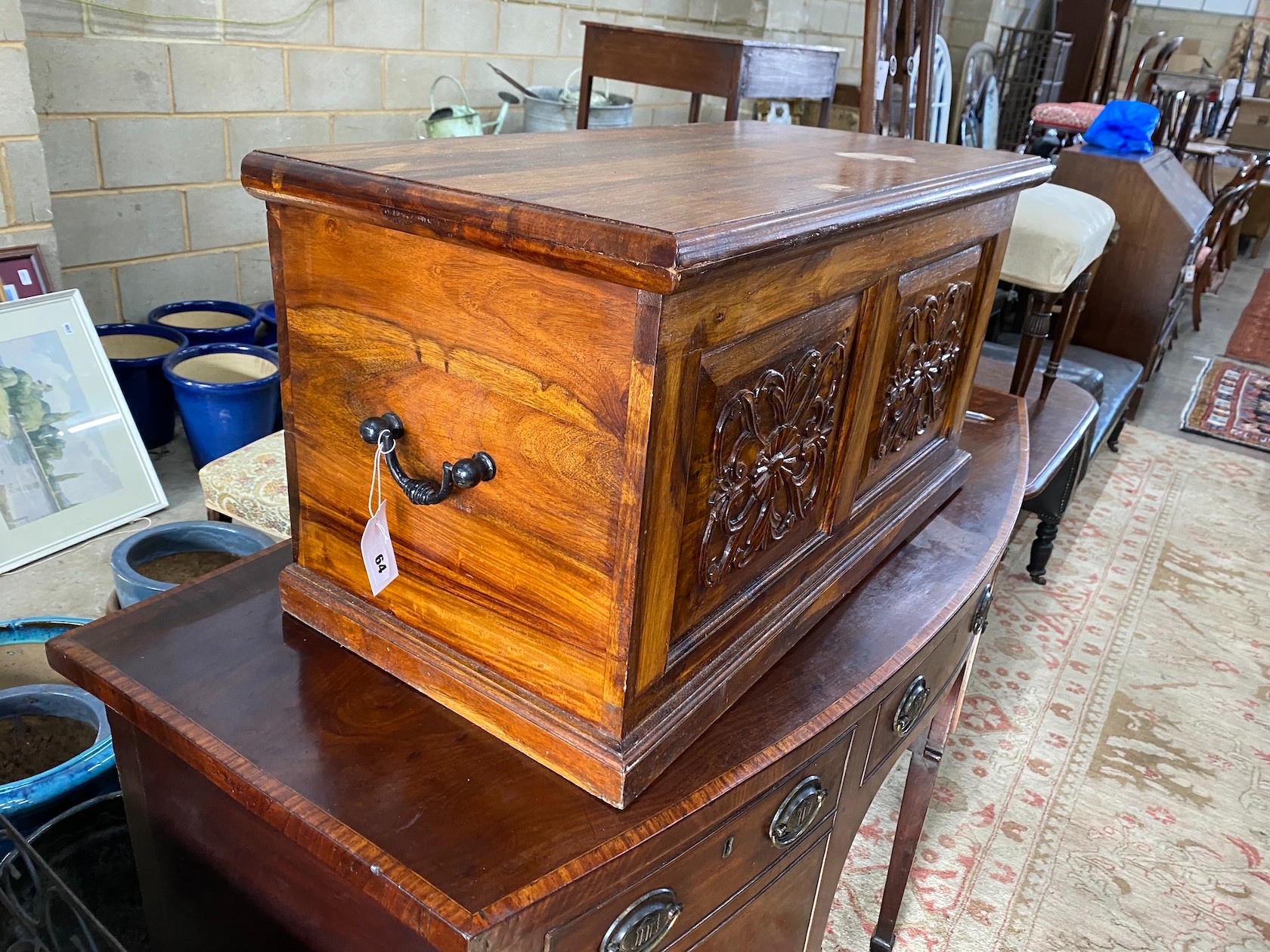 A modern carved hardwood trunk, length 80cm, depth 40cm, height 43cm